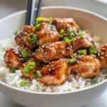 Delicious Sticky Sesame Chicken with Rice photo