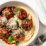 Homemade Baked Chicken Parmesan Meatballs with Roasted Garlic Spaghetti. recipe photo