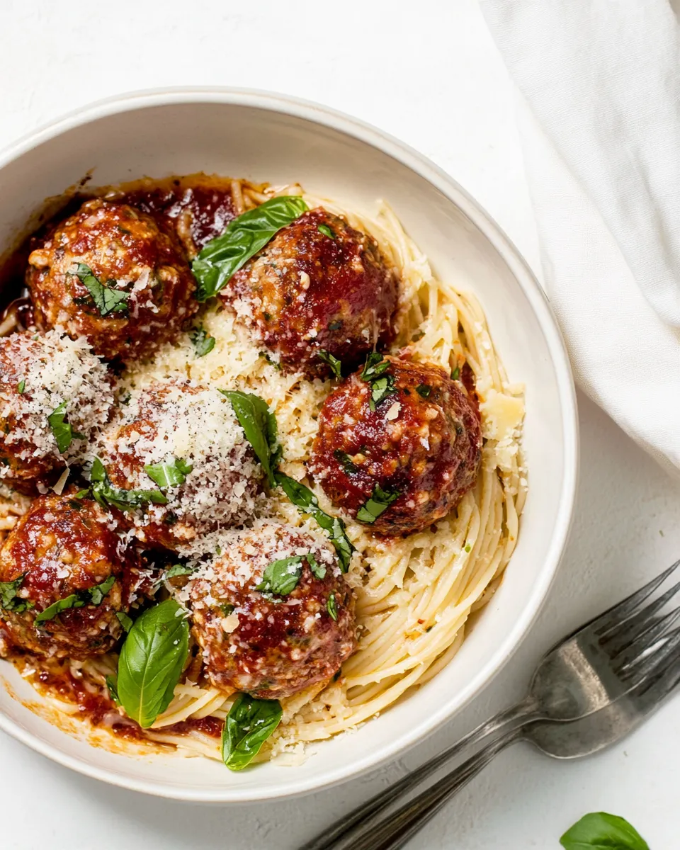 Homemade Baked Chicken Parmesan Meatballs with Roasted Garlic Spaghetti. recipe photo